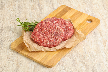Raw beef burger cutlet for grill or roastの写真素材