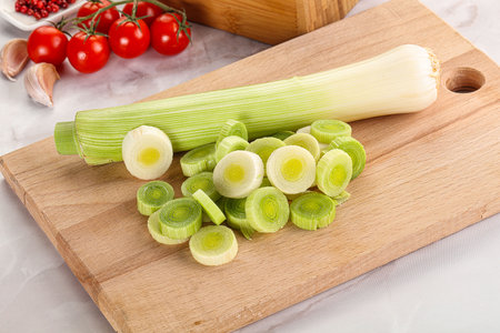 Ripe sliced leek onion over board