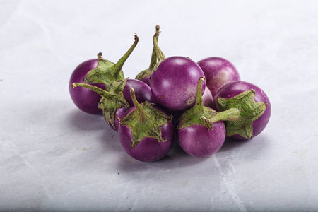 Raw small purple asian baby eggplant heapの写真素材