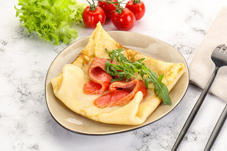 Russian pancake with salmon fish for breakfastの写真素材