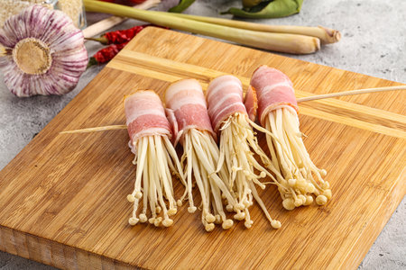 Tasty Raw Enoki mushroom with baconの写真素材