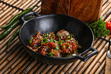 Fried spicy chicken chili with herbsの写真素材