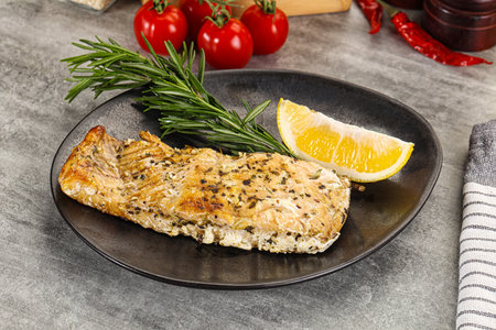 Baked salmon fish steak served rosemary