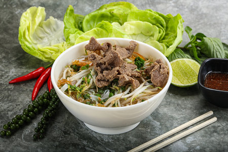 Vietnamese traditional soup Pho Bo with beef and noodlesの写真素材