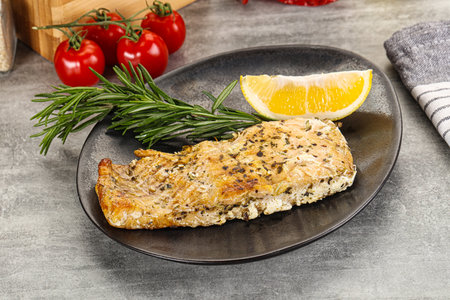 Baked salmon fish steak served rosemary