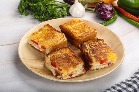 Hot sandwich with cheese, latucce and tomato