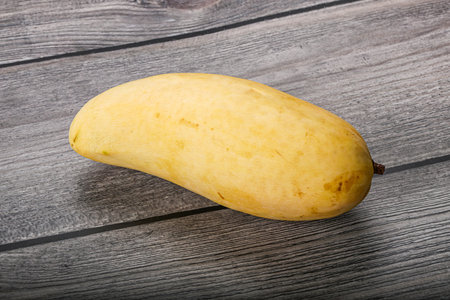 Tropical exotic fruit - ripe yellow mangoの写真素材