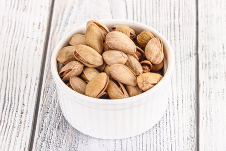 Salted tasty organic pistachio nuts heapの写真素材