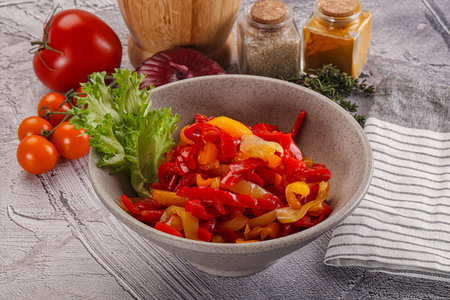 Diced raw ripe bell red and yellow pepperの写真素材