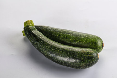 Raw young small green zucchini for cockingの写真素材