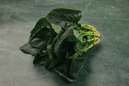 Ripe green spinach leaves heap in the bowl