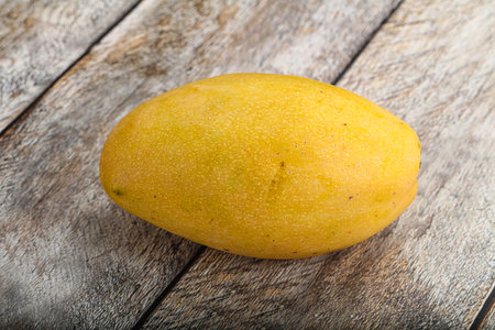 Sweet ripe juicy tropical yellow mango fruitの写真素材