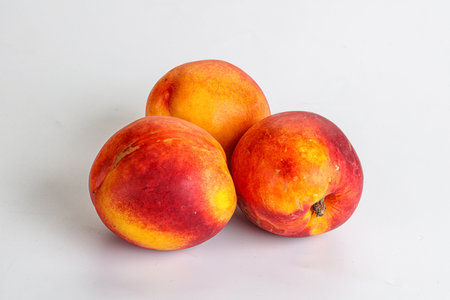 Ripe sweet juicy fresh red nectarines heapの写真素材