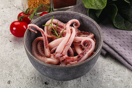 Marinated squid tentacles in the bowl for snack or saladの写真素材
