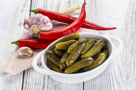 Marinated small cucumbers - cornichon - in the bowlの写真素材