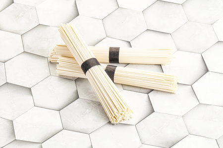 Raw asian udon wheat noodle for cookingの写真素材