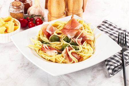 Delicious Pasta spaghetti with olives and jamonの写真素材