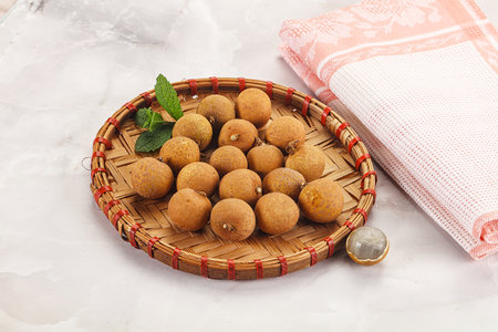 Tropical delicous fruit Longan heap in the bowl