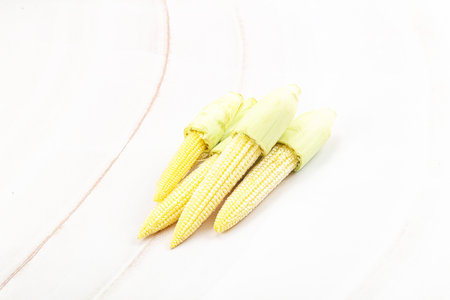 Small young sweet baby corn heapの写真素材