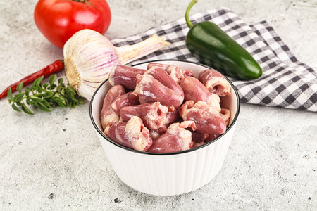 Fresh raw chicken hearts in the bowl for cooking
