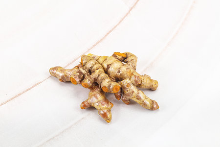 Fresh young Tumeric root heap for cooking