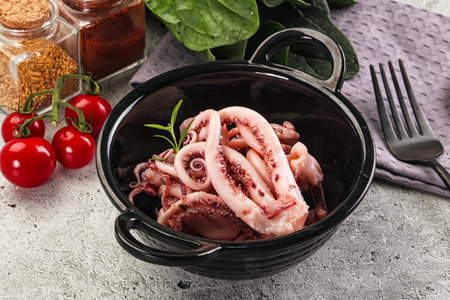 Marinated squid tentacles in the bowl for snack or salad