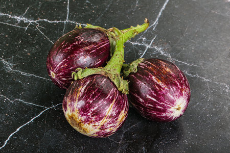 Raw ripe asian small eggplant heapの写真素材