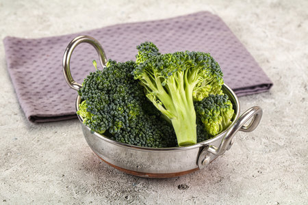 Raw green fresh broccoli cabbage in the bowlの写真素材