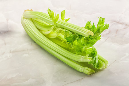 Vegan cuisine - raw green celery stemの写真素材