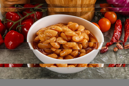 Canned beans with tomato sauce in the bowl