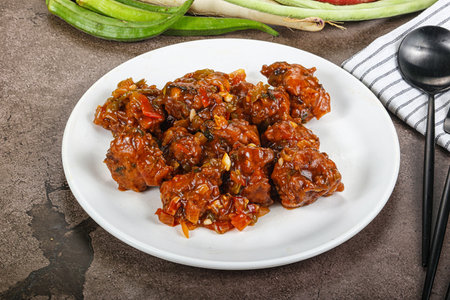 Chinese cuisine - Manchurian chicken with sauce and spices