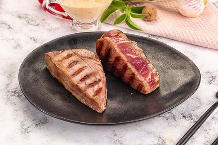 Delicous grilled tuna dish steak with peanut sauceの写真素材