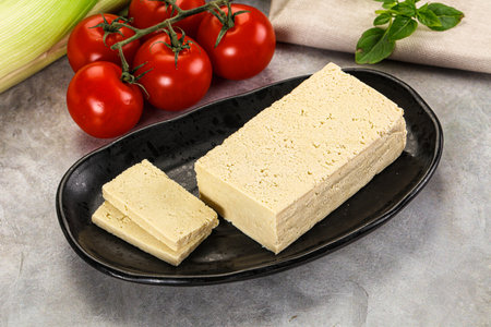 Soya vegan tofu cheese brick over board