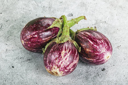 Raw ripe asian small eggplant heapの写真素材