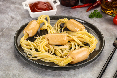 Dietary baby chicken sausage with spaghetti and sauceの写真素材