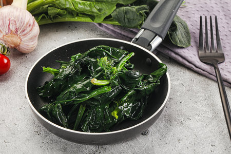 Cocked green spinach garnish with oilの写真素材