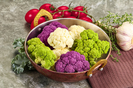 Raw cauliflower different colors heap served leafの写真素材