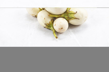 Natural organic white round eggplant heapの写真素材