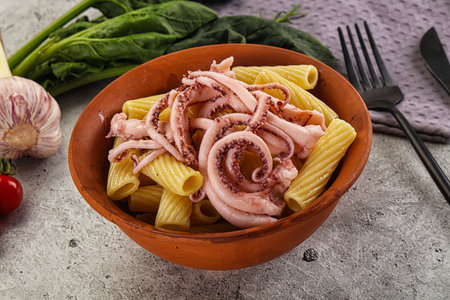 Italian cuisine - pasta tortiglioni with squid tentacles