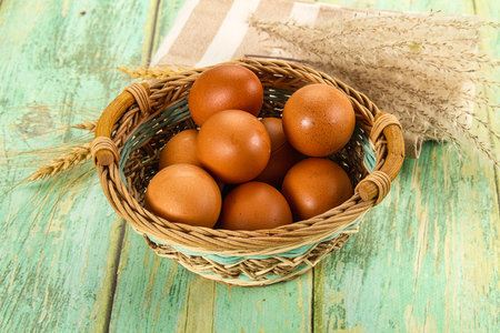 Raw brown chicken egg heap in the bowl
