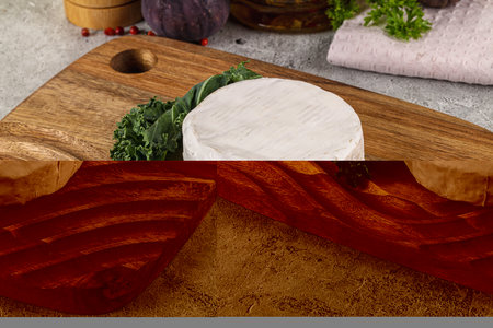 Gourmet round creamy Camembert cheese served figの写真素材