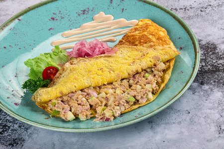 Omelet witn canned tuna fish and onionの写真素材