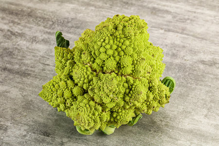 Green raw fresh ripe Romanesco cabbage for cookingの写真素材