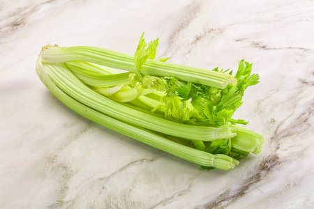 Vegan cuisine - raw green celery stemの写真素材