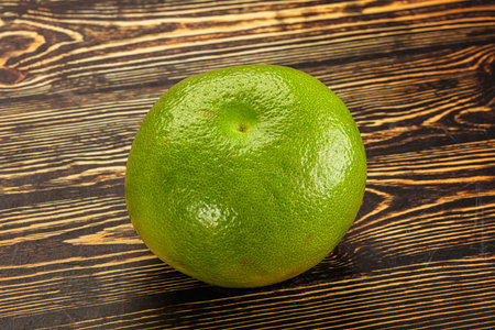 Green ripe fruit sweetie citrus over backgroundの写真素材