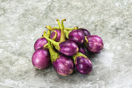 Small organic young purple round eggplant heapの写真素材