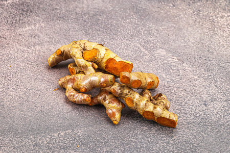 Fresh young Turmeric root heap for cookingの写真素材