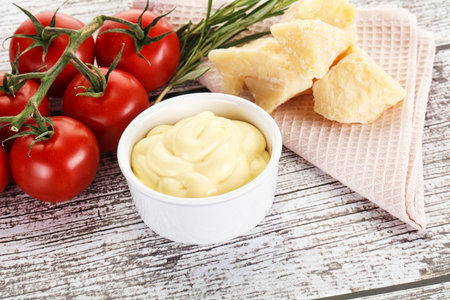 Tasty cheese sauce in the bowlの写真素材