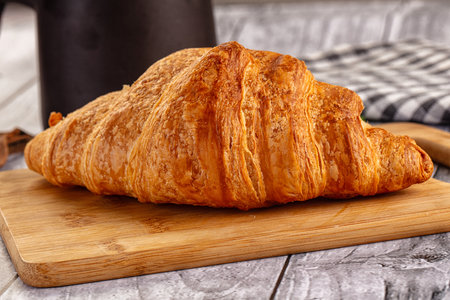 Fresh hot homemade golden croissant for breakfastの写真素材