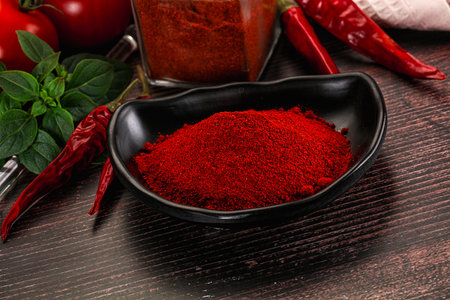 Spicy dry aroma paprika powder in the bowlの写真素材